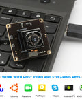 4K USB Camera Module With IBIS Stabilization Anti Shake 11MP Autofocus Lens on a keyboard, showcasing plug-and-play connectivity.