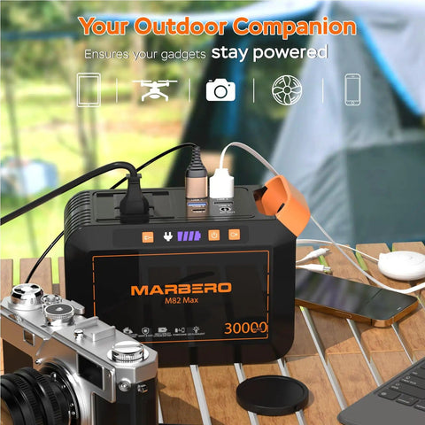 Portable Solar Generator 111Wh Power Station With 30W Solar Panel Included For Camping Outdoor Adventures Off Grid Power Emergency Backup With 120W Surge AC Outlet on campsite table charging devices