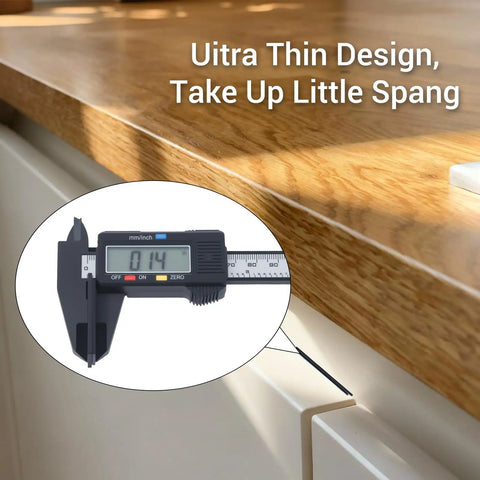 Ultra Thin Magnetic Cabinet Catch Set, 4 Pack Stick-On Drawer Magnets measuring 0.14 inches on a kitchen cabinet.