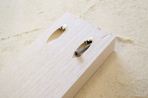 Board with Six By One And A Quarter Pan Head Pocket Screws With Square Drive For Pocket Hole Joinery in use