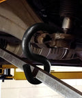 Lower Control Arm Prying Tool For Suspension Maintenance in use on vehicle, showing 0.875 inch diameter pry bar application.