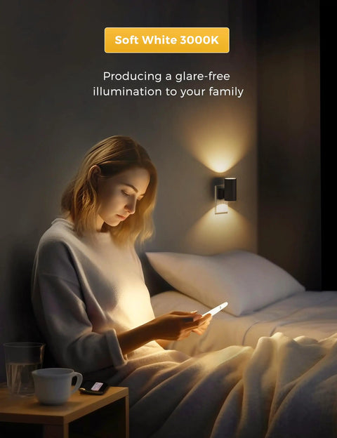Woman reading near Four Pack Plug In Night Lights With Dimmable Brightness, Light Sensor Auto On Off, Soft White 3000K Black Shade