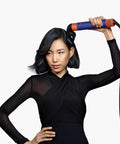 Woman using Blade Concentrator For Airwrap Styling Tool With Focused Airflow To Style One Section At A Time Without Disturbing The Rest Pro Grade And Compatible With All Airwrap Generations.