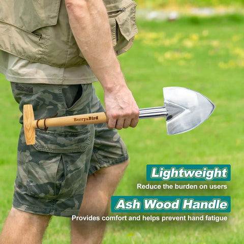Person holding Perennial Spade Trowel 21.6 Inch Long With Sharp Stainless Steel Blade And Wooden Handle outdoors