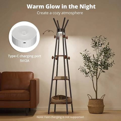 Freestanding Coat Rack With 3 Shelves And 12 Hooks, Motion Sensor Light For Entryway And Living Room next to a sofa and plant.