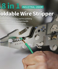 Close-up of 18 In 1 Wire Stripper Cutter Foldable Tool in use with steel jaws gripping green wire, showcasing multifunctional features.