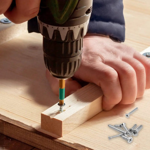 Person using a drill to install screws from the Built Tough 304 Stainless Steel Wood Screws And Self Tapping Assortment Kit 450 Piece Set.