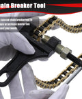 Hands using breaker tool on Gold 132 Link Motorcycle Chain With Breaker Tool For 50cc To 150cc Dirt Bikes ATVs Quad Go Kart Heavy Duty 428 Chain
