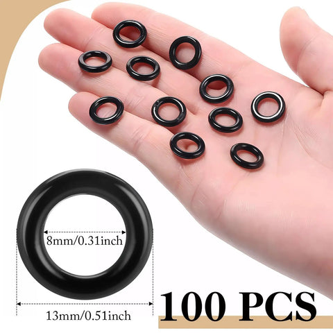 One Hundred Black Plastic Roman Blind Curtain Rings O Rings For Window Treatments Smart Cord Guides, shown in hand.