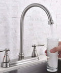 Brushed Nickel Kitchen Faucet With Side Sprayer And High Arc Two Handle Design For 3 Or 4 Hole Sinks Includes Water Supply Line And Easy Install Tool Built From Durable Stainless Steel 13.38 Inch Overall Height And 9.44 Inch Spout in use filling a glass of water