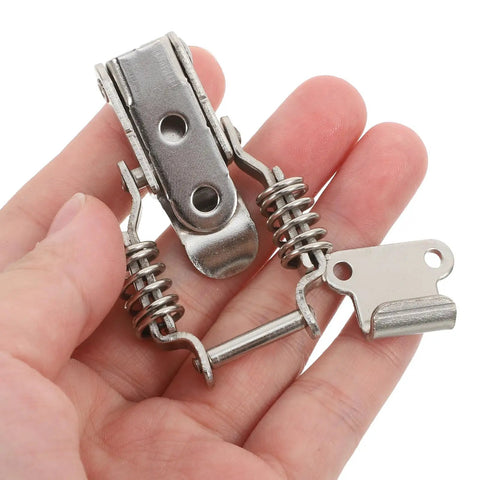 Solid 4pc Iron Spring Toggle Latch Clamps With Buckles For Toolboxes And Cabinets Super Durable Heavy Duty holders in hand.