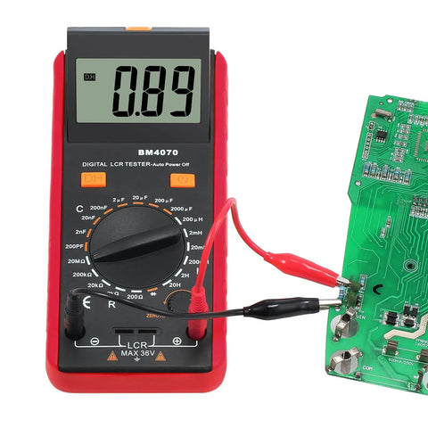 LCR Meter Capacitance Inductance Resistance Tester with LCD overrange display connected to a circuit board