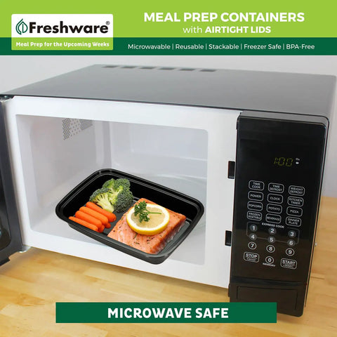 50 Pack Meal Prep Containers With Lids, 1 Compartment Bento Boxes, BPA Free, shown in microwave with salmon and carrots.