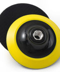 Rugged Five Inch Hook And Loop Sanding Pads With 5 8 11 Screw Thread And Cushioned Foam Backing For Angle Grinders And Power Drills, showing black surface and yellow backing.
