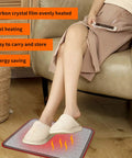 Woman using Under Desk Electric Heated Floor Mats Toe Warmer 110V For Office And Home with stone grain finish at a sofa