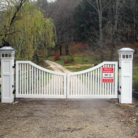 2 Pack Heavy Duty Private Property Signs No Trespassing Violators Will Be Shot on a white gated entrance to a private yard.