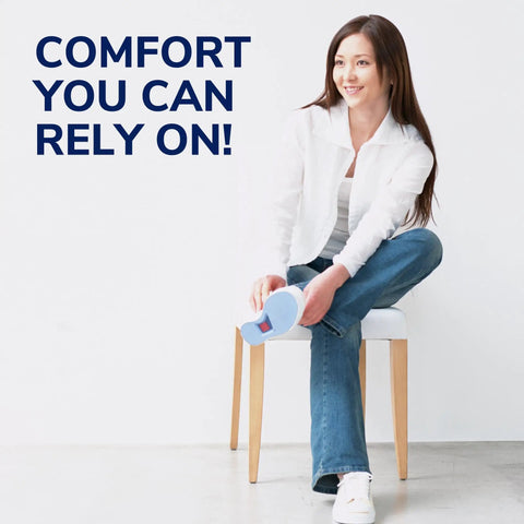 Woman sitting with Tri Comfort Women Insoles Three Quarter Length Size Six To Eleven, demonstrating ease of use.