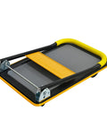 Heavy Duty Foldable Platform Hand Truck Rated At 330 Lbs With Silent Swivel Rollers That Glide Like Butter And Collapse Flawlessly For Stress Free Hauls Around Town in a collapsed position with yellow foam grip.