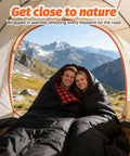 Couple in a tent using a Two Person Double Sleeping Bag With Two Pillows, Split Into Two Individual Bags Or One Queen Blanket.