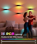 Couple dancing near Motion Sensor Wall Light With 5000Mah Battery And Remote Featuring 15 Rgb And Three Warm Modes Dimmable Wireless Sconces.