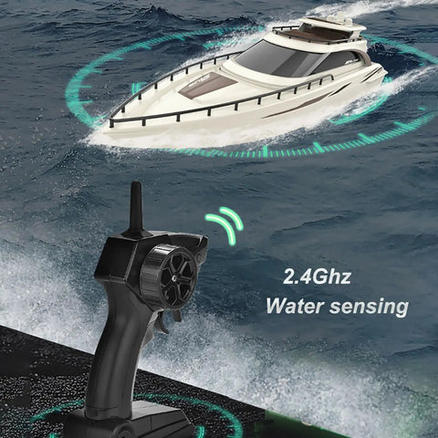 Remote Control Boat 4CH Electric RC Watercraft Yacht Style Sail Cruiser for lake and pool with controller, top view at sea.