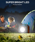 On The Go Portable Solar Generator 300W Power Station lighting a campsite scene with tent and two people at night.