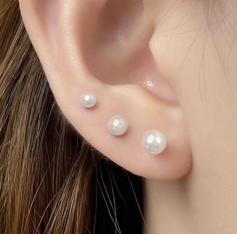 Hypoallergenic Stainless Steel Simulated Pearl Stud Earrings Set In Five Sizes For Women, Lightweight Pain Free Piercing Jewelry For Sensitive Ears, Mini Pearl Studs For Lobe Cartilage And Helix Piercings, Classic Elegant Look, three white pearl studs on ear lobe