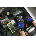 Automotive Digital Multimeter With Extra Large LCD Display And UL Listed Probes in use for car electrical diagnostics