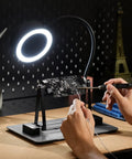 Person using Magnetic Adjustable Circuit Board Holder With 360 Degrees Rotating Clamps for soldering under ring light