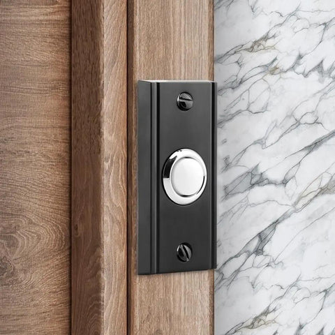 Glow Up Metal Doorbell Button With LED Light Up Night Visibility Wall Mounted Door Bell Switch Replacement For Home And Garage Doors Two Point Seven Inch Black Finish installed on wooden door frame