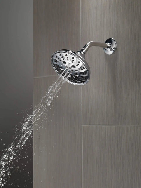 5-Setting H2OKinetic Trad Raincan Shower Head In Matte Black With Easy Touch Clean Spray Holes on a tile wall.