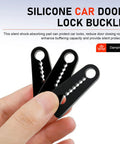 Tight 4 Piece Car Door Lock Covers Silences Rattling Clunks Smoothly Doubles As Shock Absorber Bumpers Easy Slip On Design Fits Just About Any Ride Keeps Door Closing Quiet Matte Black Pack held in hand, showing three silicone pads.