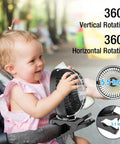 Baby interacting with Portable Desk Fan With 12000mAh Battery, LED Lights And USB Charging, 360-degree rotation display.