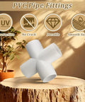 12 Pack Three Quarter Inch PVC Cross Fittings Furniture Grade Four Way UV Resistant For SCH40 Pipe on wooden surface