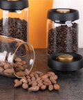 Turn Up Your Kitchen Game With This Super Durable Vacuum Sealed Glass Jar Built For Coffee Beans And Dry Goods. 1200Ml Clear airtight jars with coffee and dried nuts.