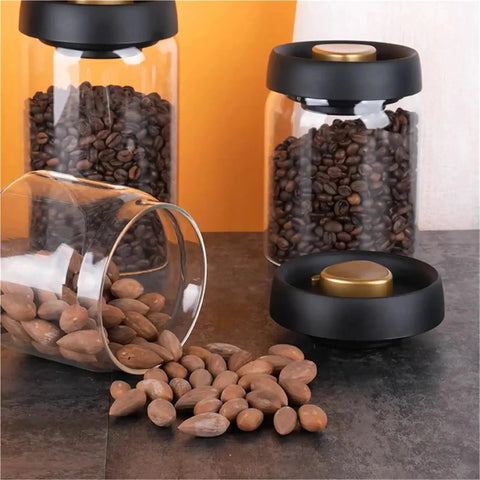 Turn Up Your Kitchen Game With This Super Durable Vacuum Sealed Glass Jar Built For Coffee Beans And Dry Goods. 1200Ml Clear airtight jars with coffee and dried nuts.
