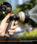 Heavy Duty Metal Hose Nozzle With 8 Spray Patterns And Thumb Control, bronze finish, used for watering, close-up view