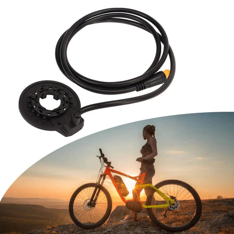 Grippy Anti Slip Dual Hall Sensor E Bike Pedal with High Sensitivity 36V 48V Interface next to cyclist at sunset