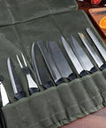 Pro Grade Heavy Duty Waxed Canvas Knife Roll Case For Chefs open with knives, portable organizer for kitchen tools.