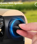 Hand adjusting knob on Go To Portable Camping Stove 1400W Butane Collapsible Backpacking Stove for ignition.