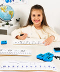 Child using 12 Pack Double-Sided Dry Erase Number Line Whiteboards Set 4x12 Inches for students classroom math manipulatives learning tool.
