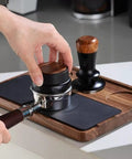 Heavy Duty Wooden Espresso Tamper Station Holder Fits 51mm To 58mm Portafilters, using grippy non-slip base with a coffee tamper.