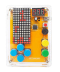 Front view of Hands On Solder Kit With Five Retro Game Classics For Electronics Practice And Learning Handheld Size In Clear Acrylic Case Easy To Build And Play Great Gift For Family And Friends, showing circuit and buttons in clear case.