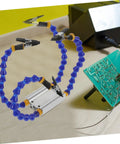 Heavy-Duty Soldering Helping Hand Tool With Flexible Arms And Welding Station Holder For Expert Pcb Repair on workbench