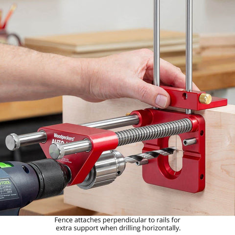 Person using Auto Line Drill Guide Portable Drill Guide for Perpendicular Holes Up to Two Inches with Laser Centerlines on wooden block