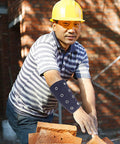 Lightweight Cut Resistant Wrist Guards With Breathable Mesh Sleeves For Mechanics And Yard Work, worn by a worker handling bricks.