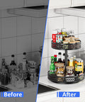 Two-tier black metal Lazy Susan organizer on kitchen counter with 12-inch rotating turntable and spice jars.