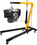 Heavy Duty Rolling Boom Engine Hoist With Two Thousand Pounds Capacity Fold Up Legs and Smooth Swivel Casters lifting an engine in garage.