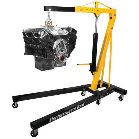 Heavy Duty Rolling Boom Engine Hoist With Two Thousand Pounds Capacity Fold Up Legs and Smooth Swivel Casters lifting an engine in garage.