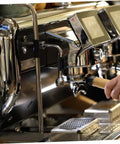 Close-up of espresso machine with Heat Sleeve For Steam Pipe Rubber Cover For Espresso Machine Insulation Kit installed.